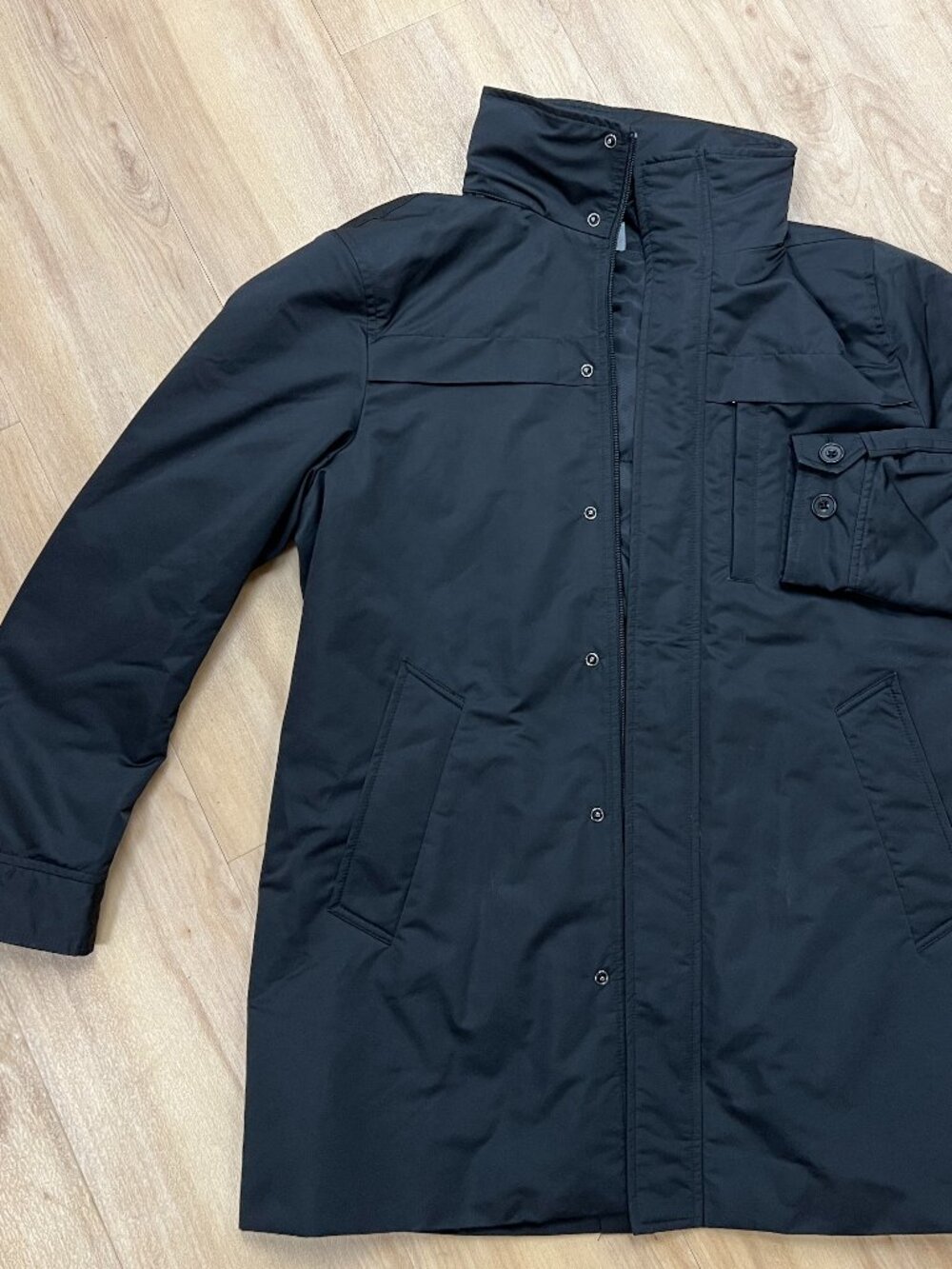 Uniqlo Air Tech Coat in black concealed hood